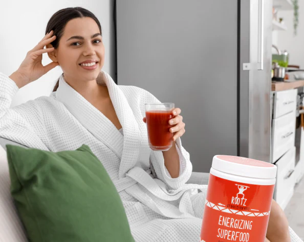 Rootz Energizing Superfood jar with fresh ingredients, symbolizing steady energy, sharper focus, better recovery, metabolism boost, and backed by a 30-day money-back guarantee
